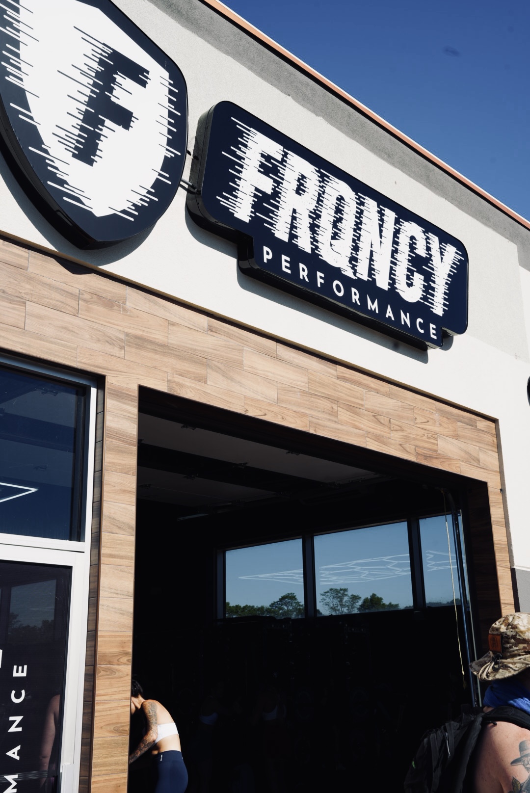 FRQNCY Performance gym storefront signage and exterior branding