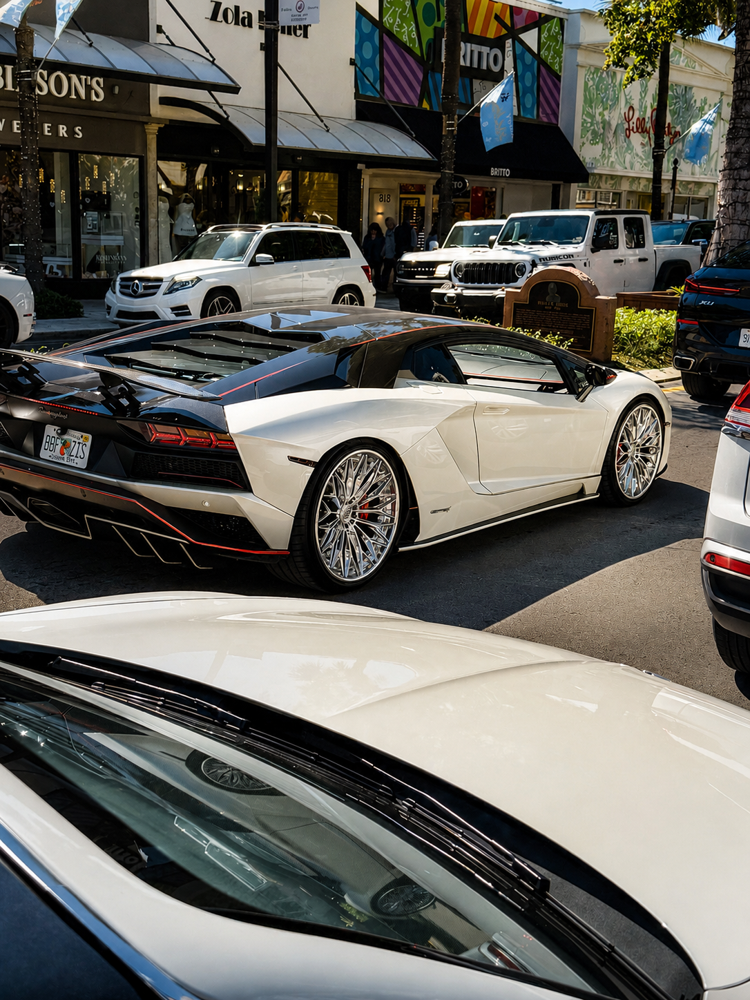 White Lamborghini Aventador S with carbon rear on a Palm Beach shopping street